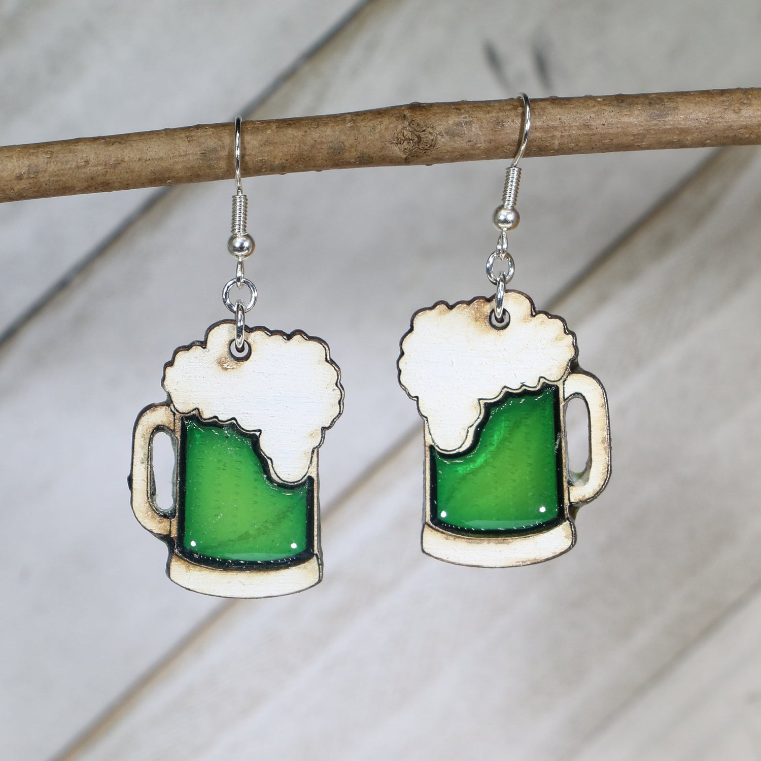 Hand-painted wooden green beer mug dangle earrings with festive St. Patrick’s Day design and hypoallergenic sterling silver hooks, lightweight novelty jewelry for bar crawls and Irish celebrations by Cate’s Concepts
