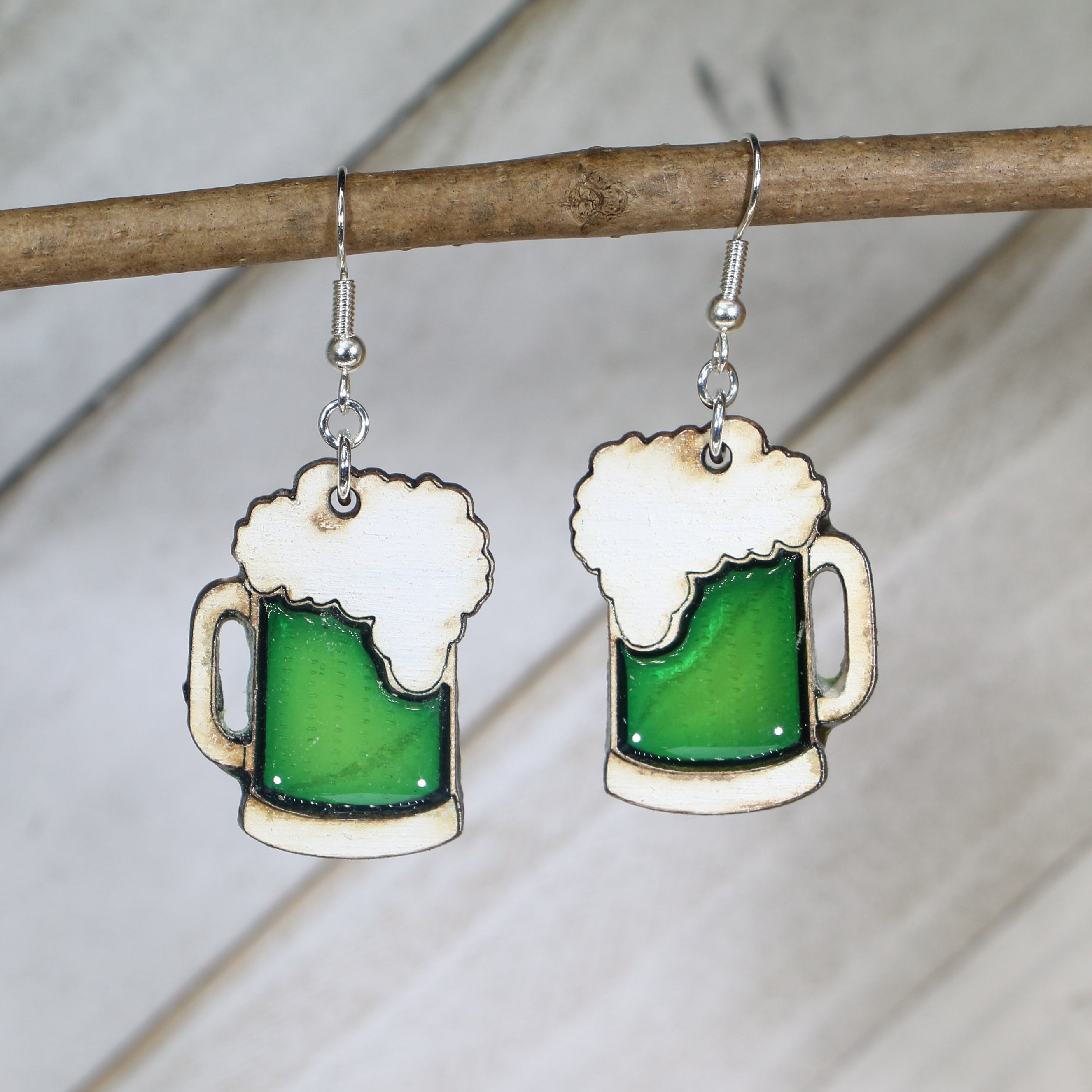 Hand-painted wooden green beer mug dangle earrings with festive St. Patrick’s Day design and hypoallergenic sterling silver hooks, lightweight novelty jewelry for bar crawls and Irish celebrations by Cate’s Concepts
