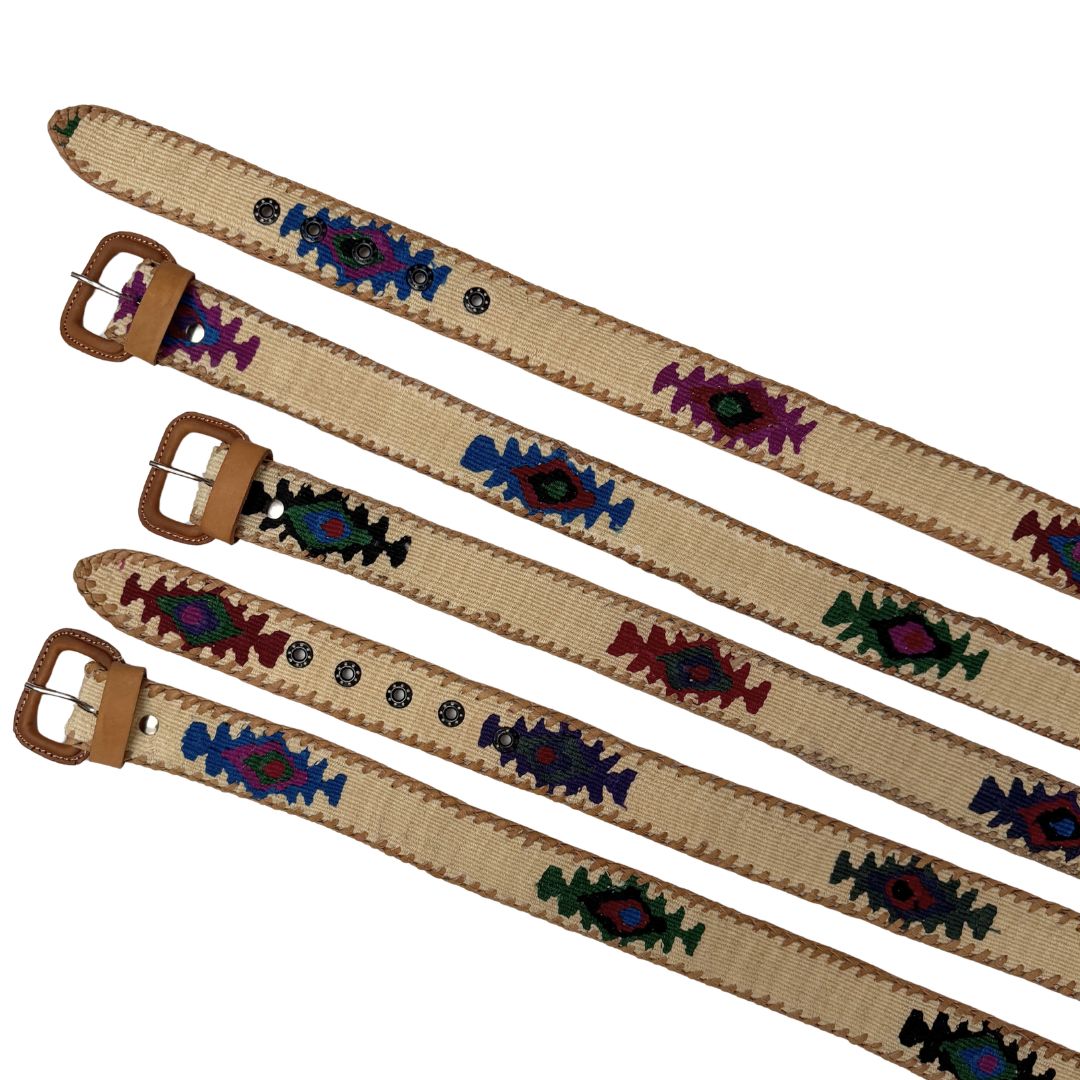 Four woven belts with tan leather buckles and brown edges, decorated with colorful geometric and floral patterns in blue, green, purple, and red on a white background.
