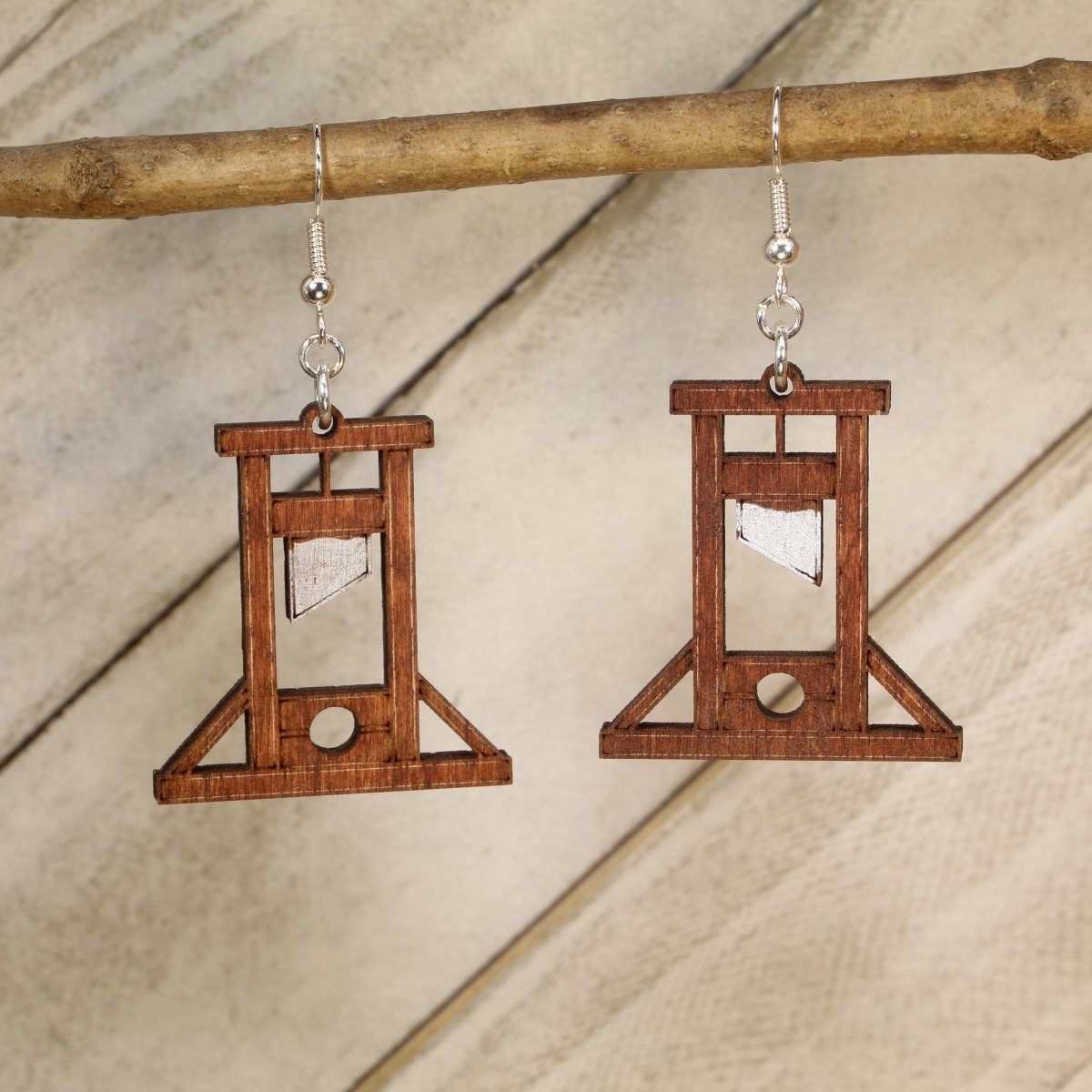 Hand-painted wooden guillotine dangle earrings with gothic historic design and hypoallergenic sterling silver hooks, quirky dark humor statement jewelry for spooky style lovers