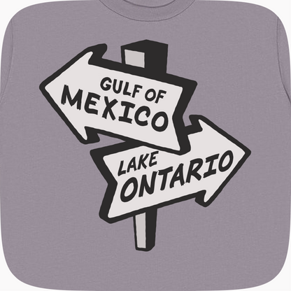 A close-up of a gray t-shirt featuring a graphic print of a split road sign pointing left to &