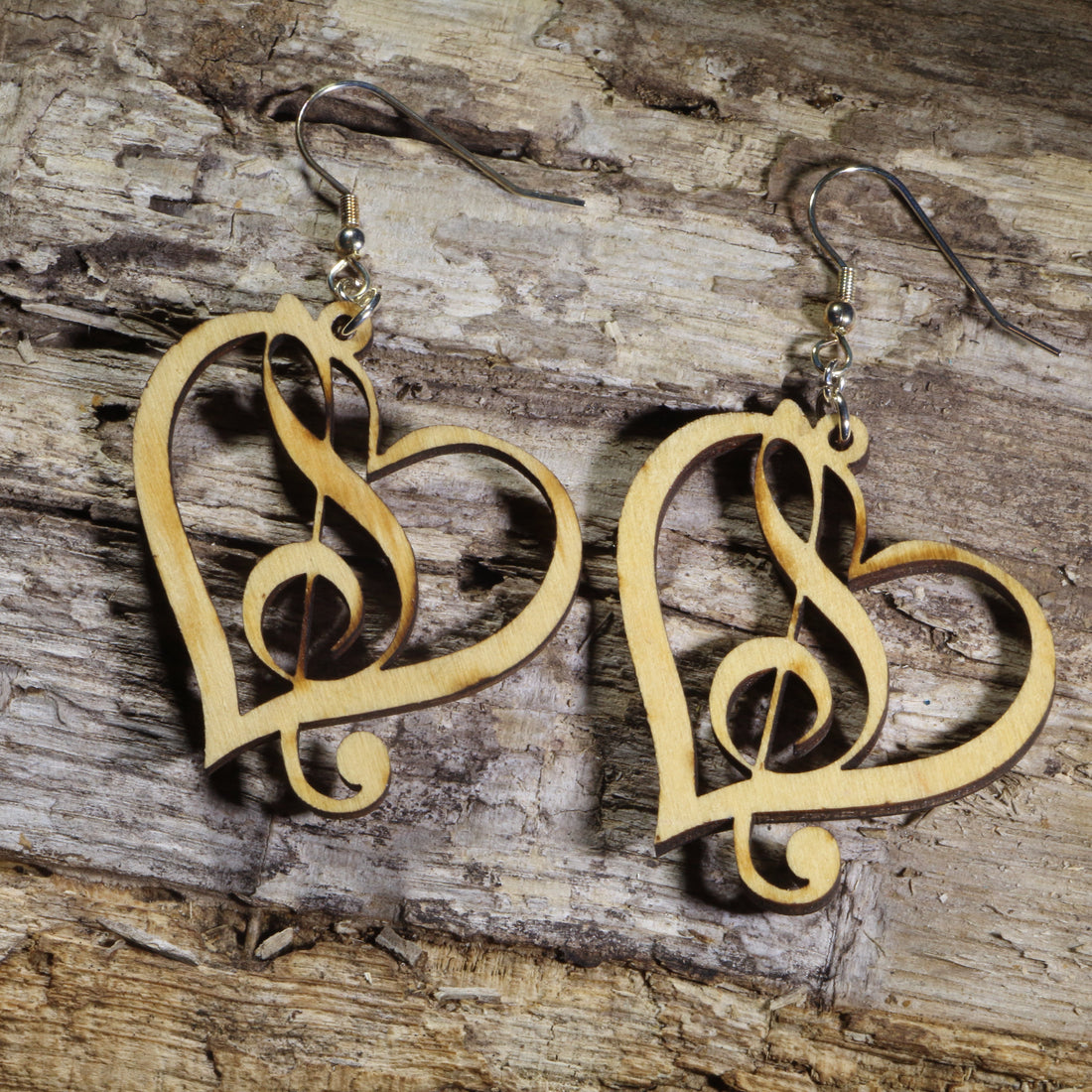 Hand-painted heart and treble clef wooden dangle earrings on hypoallergenic .925 sterling silver hooks. Lightweight music jewelry featuring an elegant heart-shaped treble clef design, perfect for musicians, choir members, music teachers, singers, and music lovers.