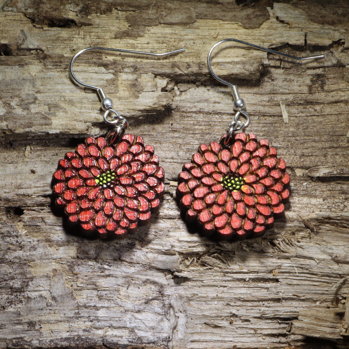 Hand-painted red zinnia wooden dangle earrings featuring a smaller layered flower design with detailed petals and green-yellow center. Lightweight floral earrings with hypoallergenic .925 sterling silver hooks, perfect for gardeners, flower lovers, nature enthusiasts, and botanical jewelry gifts.
