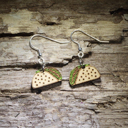 Hand-painted taco wooden dangle earrings featuring a crunchy taco shell filled with colorful lettuce and savory toppings. Lightweight food jewelry perfect for taco lovers, Taco Tuesday outfits, Mexican food fans, foodies, and fun culinary gifts.
