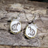 Hand-painted wooden cat skeleton cameo dangle earrings featuring an elegant feline skeleton framed in an ornate vintage cameo on hypoallergenic .925 sterling silver hooks. Lightweight gothic jewelry for cat lovers, Halloween enthusiasts, dark academia fans, veterinarians, anatomy enthusiasts, and collectors of spooky accessories.