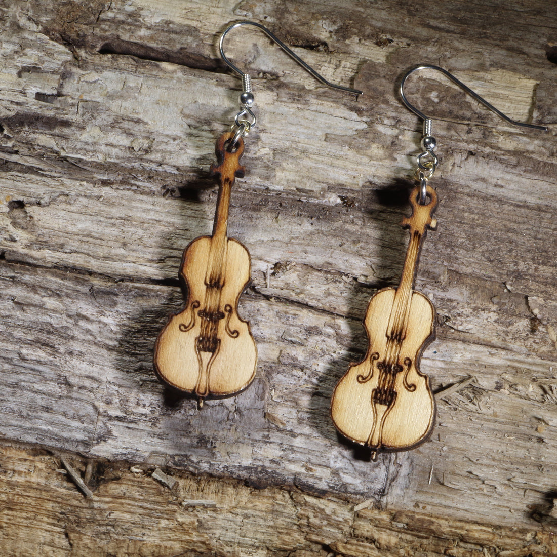 Hand-painted wooden cello dangle earrings with engraved strings and classic instrument details on hypoallergenic .925 sterling silver hooks. Lightweight orchestra jewelry perfect for cellists, string musicians, music teachers, and classical music lovers.