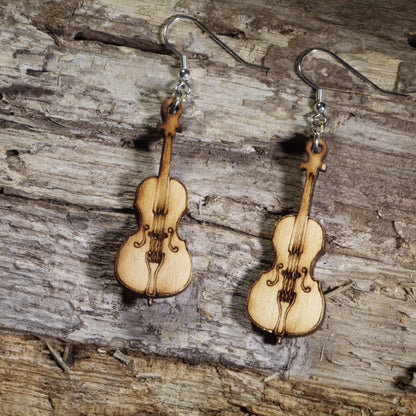 Hand-painted wooden cello dangle earrings with engraved strings and classic instrument details on hypoallergenic .925 sterling silver hooks. Lightweight orchestra jewelry perfect for cellists, string musicians, music teachers, and classical music lovers.