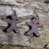 Hand-painted wooden chocolate gingerbread man dangle earrings with festive Christmas details. Lightweight holiday earrings featuring hypoallergenic .925 sterling silver hooks, perfect for Christmas parties, cookie exchanges, winter celebrations, and seasonal gift giving.