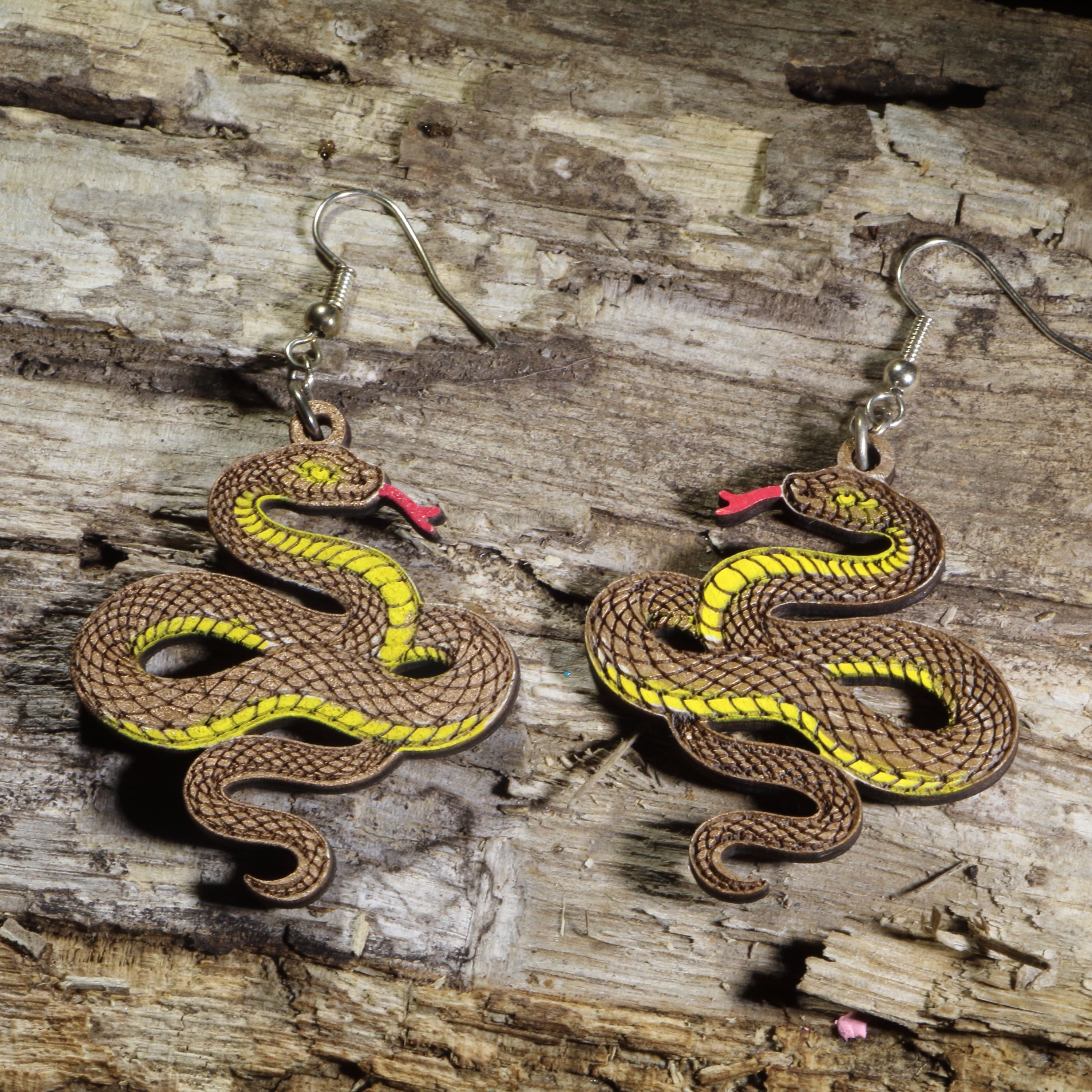 Hand-painted wooden copper snake dangle earrings featuring a coiled copper serpent design on hypoallergenic .925 sterling silver hooks. Lightweight reptile nature jewelry for snake lovers, herpetologists, wildlife enthusiasts, and anyone who appreciates unique animal-inspired accessories.