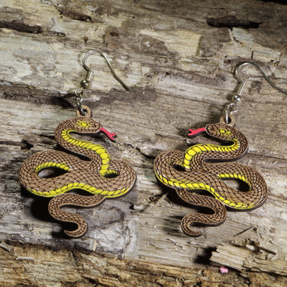 Hand-painted wooden copper snake dangle earrings featuring a coiled copper serpent design on hypoallergenic .925 sterling silver hooks. Lightweight reptile nature jewelry for snake lovers, herpetologists, wildlife enthusiasts, and anyone who appreciates unique animal-inspired accessories.