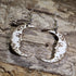 Hand-painted wooden crescent moon dangle earrings featuring engraved vintage moon face details on hypoallergenic .925 sterling silver hooks. Lightweight celestial jewelry perfect for moon lovers, astrology enthusiasts, witchy style, gothic fashion, and lunar-inspired accessories.