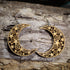 Hand-painted wooden cutout crescent moon dangle earrings featuring an intricate celestial cutout design with stars and swirling patterns on hypoallergenic .925 sterling silver hooks. Lightweight moon jewelry for astronomy lovers, astrology enthusiasts, witches, pagans, celestial decor fans, and lovers of mystical accessories.