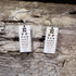 Hand-painted wooden eye chart dangle earrings featuring a classic vision test chart design on lightweight wood with hypoallergenic .925 sterling silver hooks. Perfect for optometrists, ophthalmologists, eye doctors, optometry students, vision care professionals, and unique medical-themed jewelry lovers.