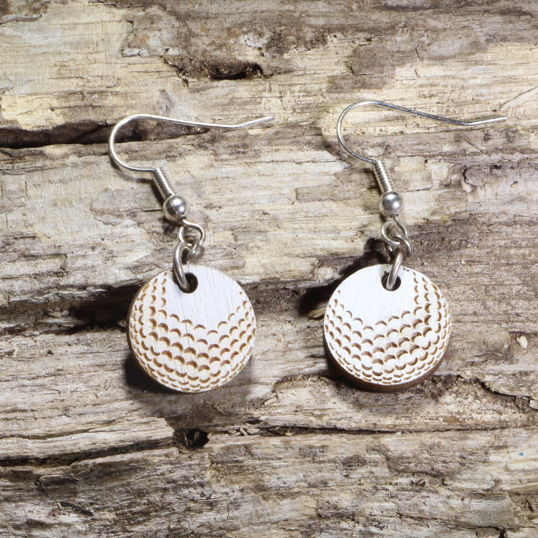Hand-painted wooden golf ball dangle earrings featuring realistic engraved dimples on hypoallergenic .925 sterling silver hooks. Lightweight golf jewelry for golfers, golf coaches, country club members, tournament gifts, and golf enthusiasts.