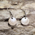 Hand-painted wooden golf ball dangle earrings featuring realistic engraved dimples on hypoallergenic .925 sterling silver hooks. Lightweight golf jewelry for golfers, golf coaches, country club members, tournament gifts, and golf enthusiasts.