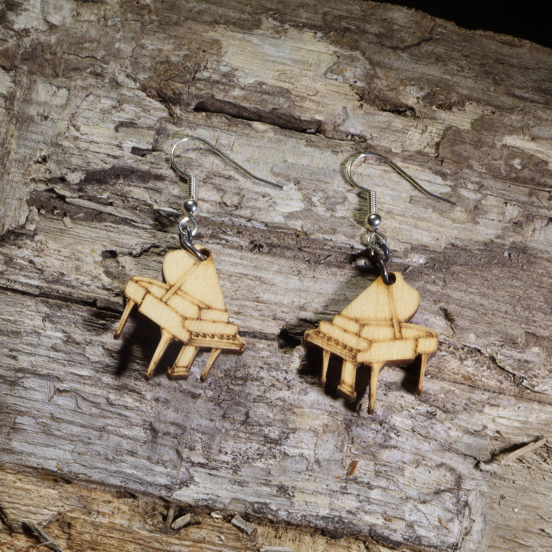 Hand-painted wooden grand piano dangle earrings featuring detailed baby grand pianos on hypoallergenic .925 sterling silver hooks. Lightweight music-inspired jewelry for pianists, piano teachers, musicians, music students, and classical music lovers.