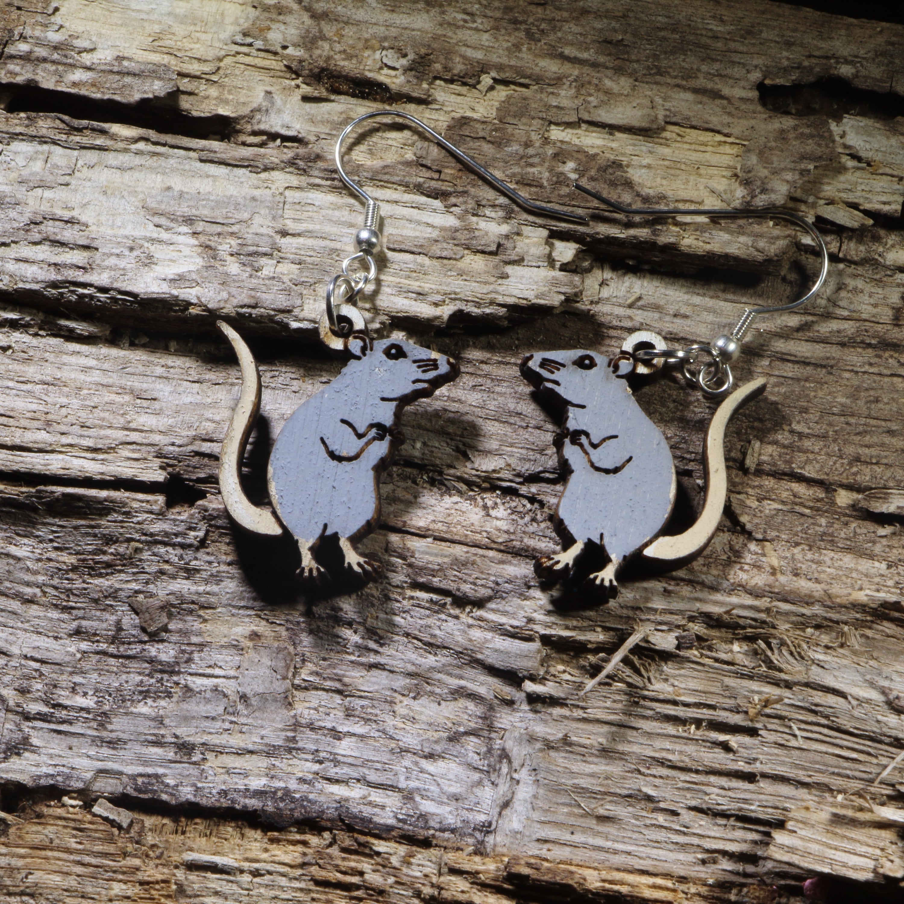 Hand-painted wooden gray rat dangle earrings featuring an adorable standing rat design with a long tail and detailed engraving. Lightweight animal earrings with hypoallergenic .925 sterling silver hooks, perfect for rat lovers, pet rat owners, rodent enthusiasts, wildlife fans, and anyone who loves unique handmade jewelry.