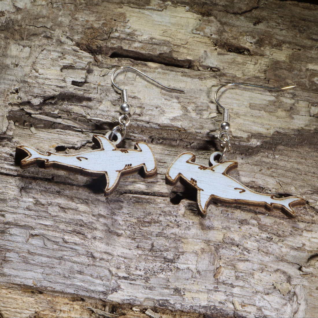 Hand-painted wooden hammerhead shark dangle earrings on hypoallergenic .925 sterling silver hooks. Lightweight ocean jewelry for shark lovers, marine biologists, scuba divers, beach enthusiasts, and sea life fans.