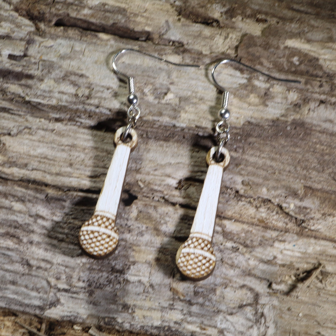 Hand-painted wooden handheld microphone dangle earrings with engraved microphone grille details on hypoallergenic .925 sterling silver hooks. Lightweight music jewelry perfect for singers, vocalists, karaoke enthusiasts, podcasters, and music lovers.