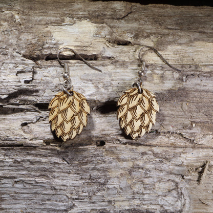 Hand-painted wooden hops dangle earrings featuring detailed hop cones on lightweight wood with hypoallergenic .925 sterling silver hooks. Perfect for craft beer lovers, homebrewers, brewery staff, beer festival fans, hop enthusiasts, and unique brewing-inspired jewelry.