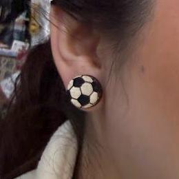 Hand-painted wooden soccer ball stud 
earrings featuring a classic black-and-white soccer ball design. Lightweight wooden earrings with hypoallergenic .925 sterling silver hooks, perfect for soccer players, coaches, team moms, referees, and sports fans.