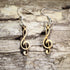 Hand-painted wooden treble clef dangle earrings featuring the classic treble clef music symbol on hypoallergenic .925 sterling silver hooks. Lightweight music jewelry for pianists, singers, choir members, band and orchestra musicians, music teachers, composers, and lovers of musical notation.