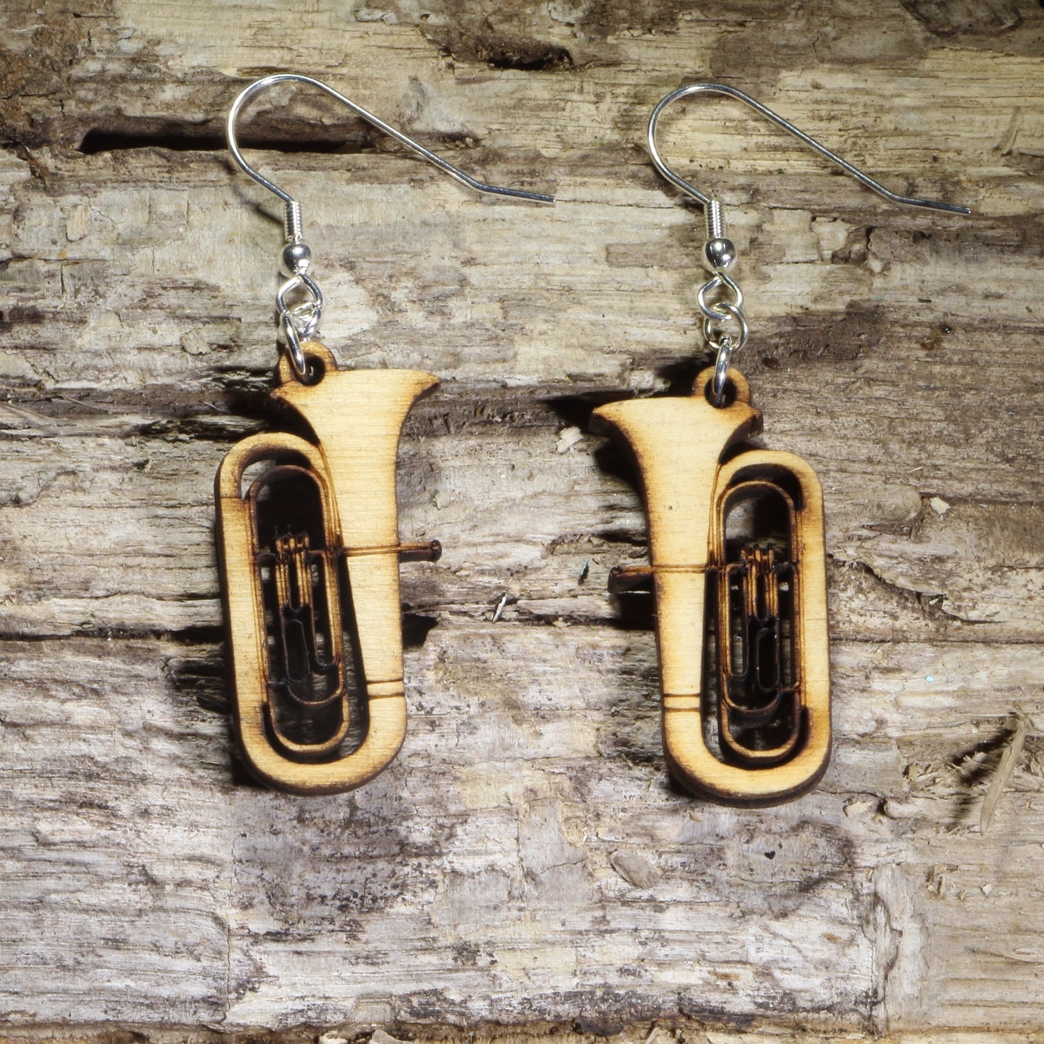 Hand-painted wooden tuba dangle earrings featuring detailed concert tubas with engraved brass instrument accents on hypoallergenic .925 sterling silver hooks. Lightweight music jewelry for tuba players, band directors, marching band members, orchestra musicians, music teachers, and brass instrument enthusiasts.