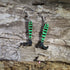 Hand-painted wooden witch legs dangle earrings featuring striped stockings, pointed black witch shoes, and a whimsical Halloween design. Lightweight Halloween earrings with hypoallergenic .925 sterling silver hooks, perfect for spooky season, Halloween parties, witch lovers, trick-or-treat events, and festive fall outfits.