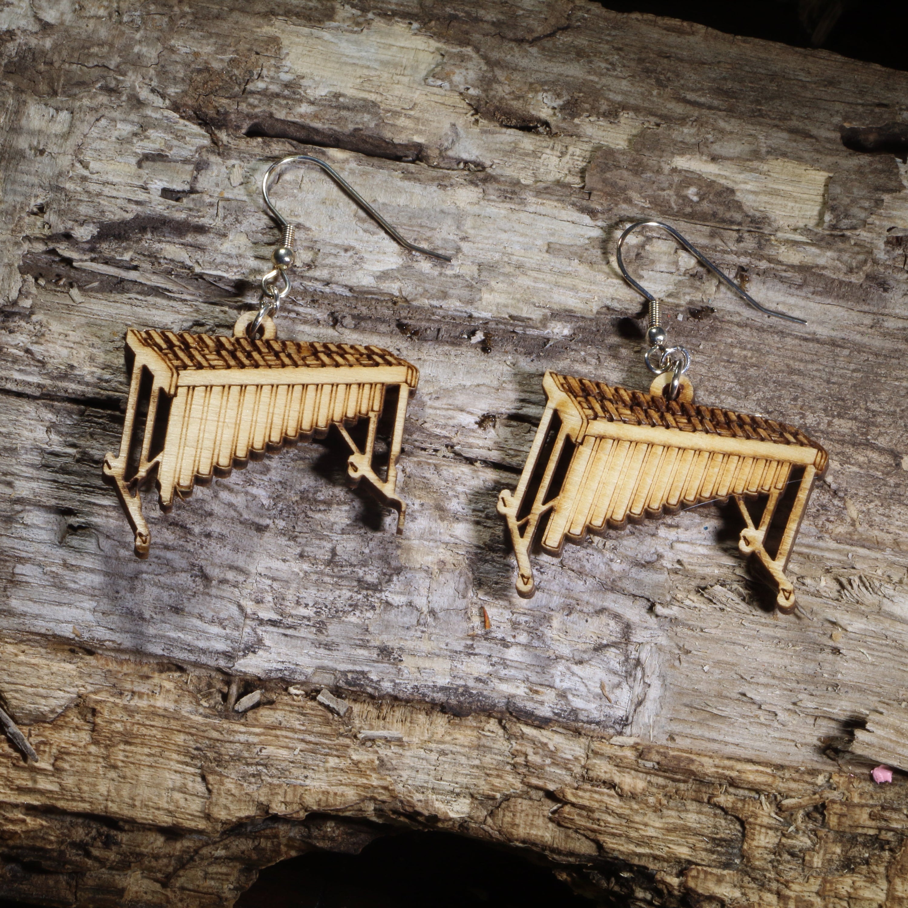 Hand-painted wooden marimba dangle earrings featuring detailed concert marimbas on hypoallergenic .925 sterling silver hooks. Lightweight percussion-inspired jewelry for marimba players, percussionists, band directors, music teachers, orchestra musicians, and music lovers.
