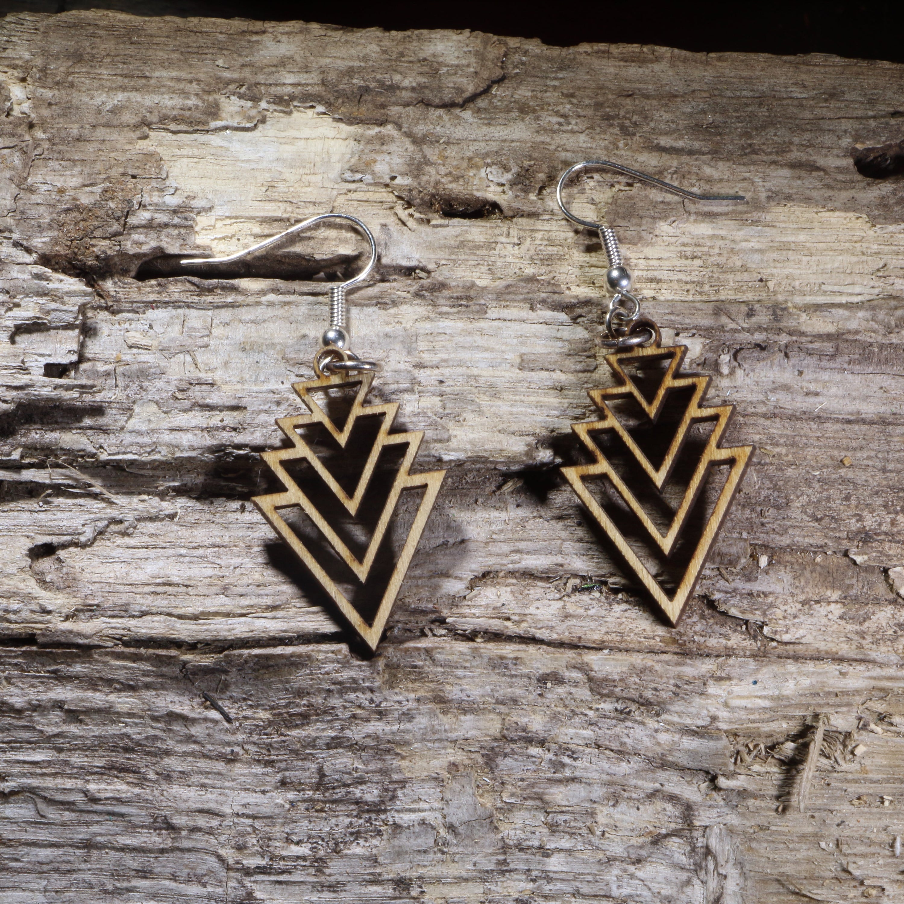 Handcrafted Art Deco Cascade wooden dangle earrings featuring an elegant geometric layered arrow design. Lightweight laser-cut wooden earrings with hypoallergenic .925 sterling silver hooks, perfect for Art Deco fashion, geometric jewelry lovers, minimalist style, vintage-inspired accessories, and everyday wear.