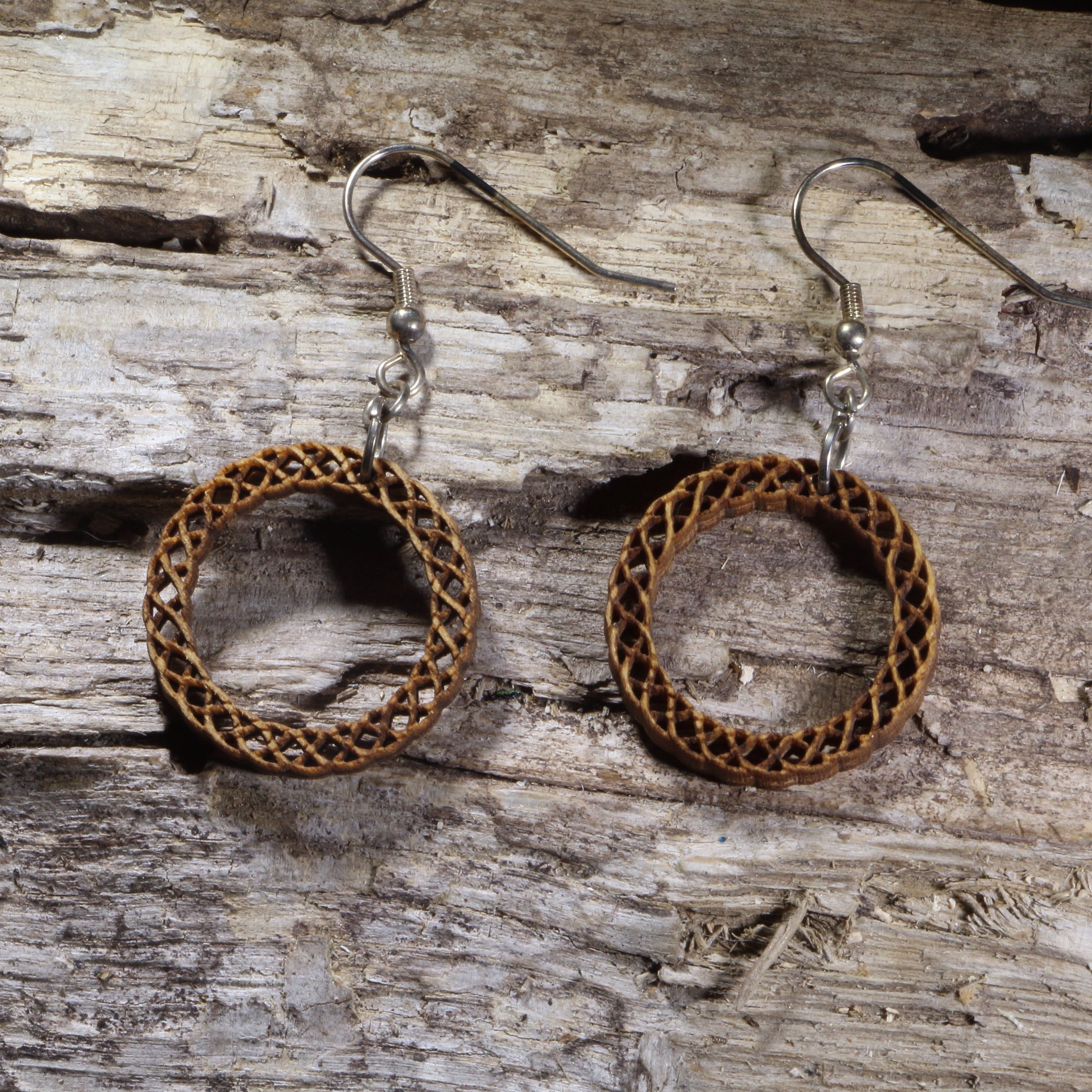 Handcrafted Celtic Knot Circle wooden dangle earrings featuring an intricate circular Celtic knot design symbolizing eternity and interconnectedness. Lightweight laser-cut wooden earrings with hypoallergenic .925 sterling silver hooks, perfect for Celtic jewelry lovers, Irish heritage, pagan traditions, spiritual accessories, and timeless everyday wear.