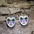 Handcrafted Mardi Gras mask wooden dangle earrings featuring an elegant carnival mask hand-painted in purple, green, gold, and white. Lightweight laser-cut wooden earrings with hypoallergenic .925 sterling silver hooks, perfect for Mardi Gras celebrations, New Orleans festivals, masquerade parties, carnival costumes, and festive handmade jewelry.
