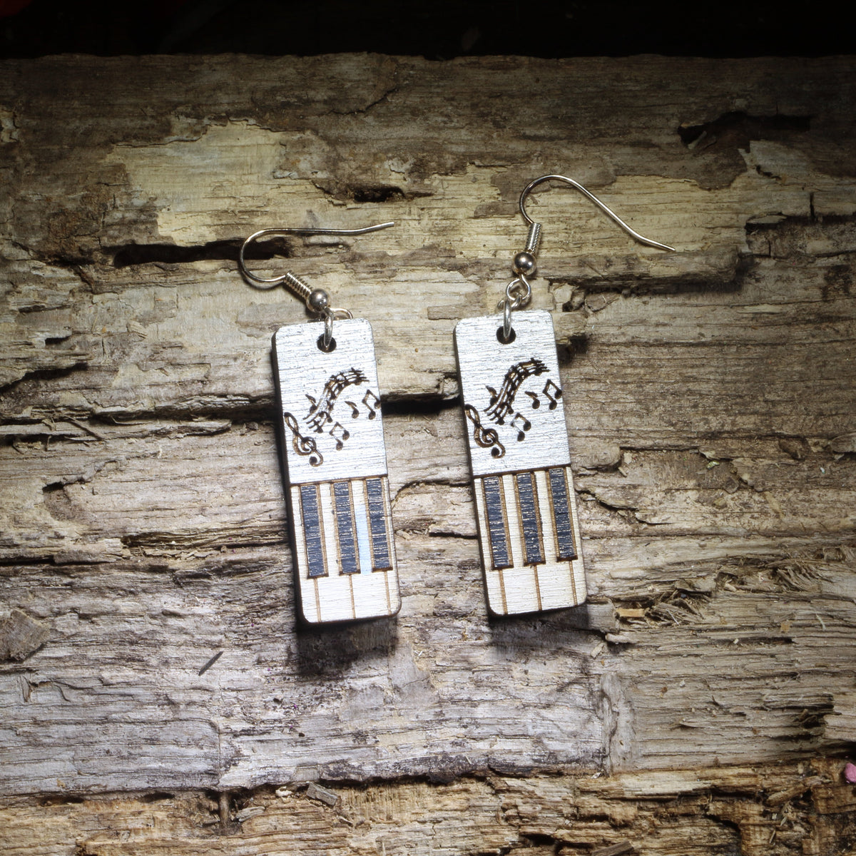 Handcrafted Piano Keyboard with Music Notes wooden dangle earrings featuring a detailed piano keyboard and flowing musical notes design. Lightweight laser-cut wooden earrings with hypoallergenic .925 sterling silver hooks, perfect for pianists, piano teachers, music students, musicians, choir and band directors, and music lovers.