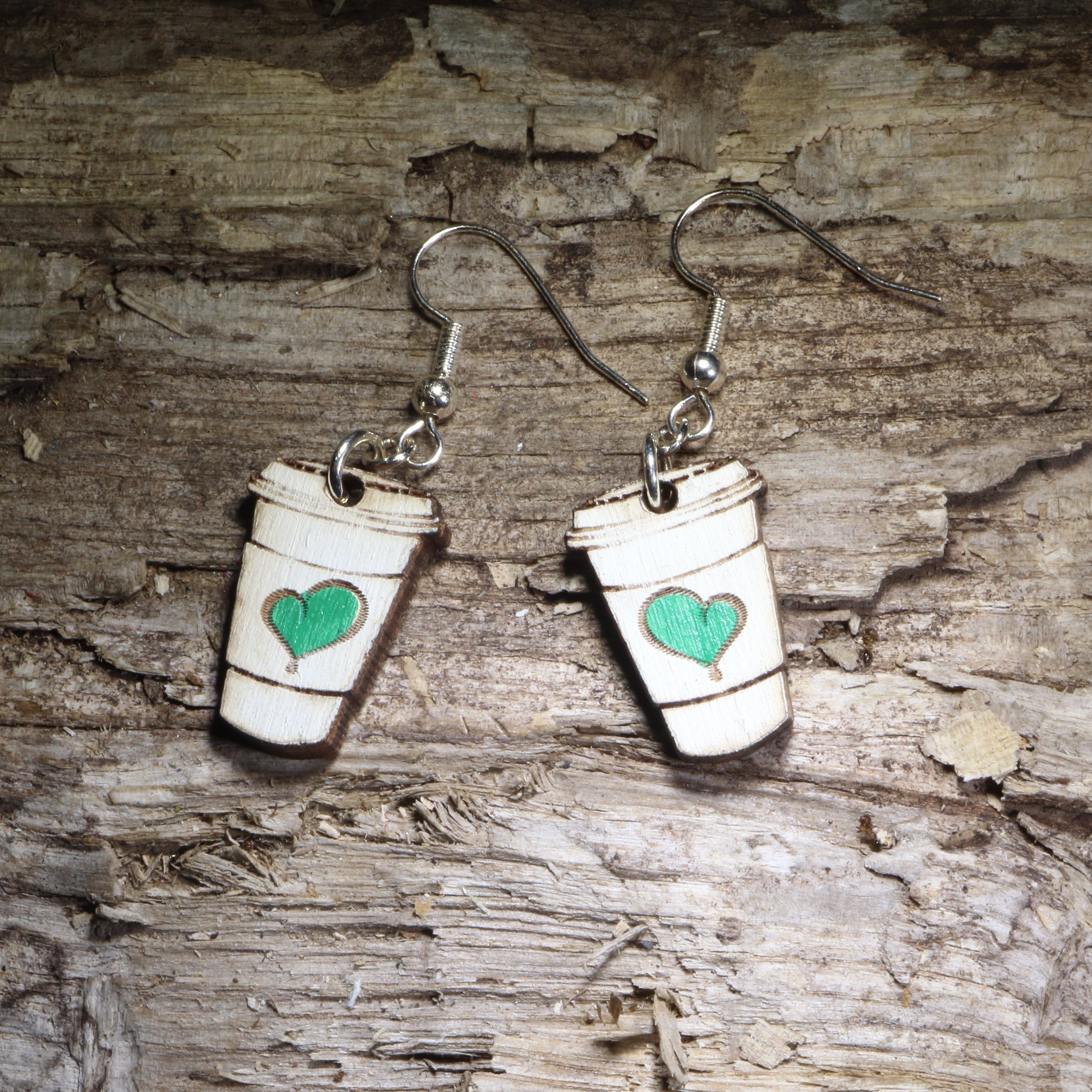 Handcrafted coffee cup wooden dangle earrings featuring a charming green heart design. Lightweight hand-painted wooden earrings with hypoallergenic .925 sterling silver hooks, perfect for coffee lovers, baristas, café enthusiasts, espresso fans, tea drinkers, and anyone who can&