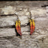 Handcrafted ombré feather wooden dangle earrings featuring hand-painted yellow, orange, and red gradient feathers with engraved detailing. Lightweight laser-cut wooden earrings with hypoallergenic .925 sterling silver hooks, perfect for boho fashion, autumn accessories, nature lovers, festival wear, and colorful handcrafted jewelry.