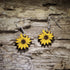 Handcrafted sunflower wooden dangle earrings featuring vibrant hand-painted yellow sunflower blooms with detailed brown centers. Lightweight laser-cut wooden earrings with hypoallergenic .925 sterling silver hooks, perfect for sunflower lovers, gardeners, cottagecore style, nature enthusiasts, summer fashion, floral gifts, and handmade botanical jewelry.
