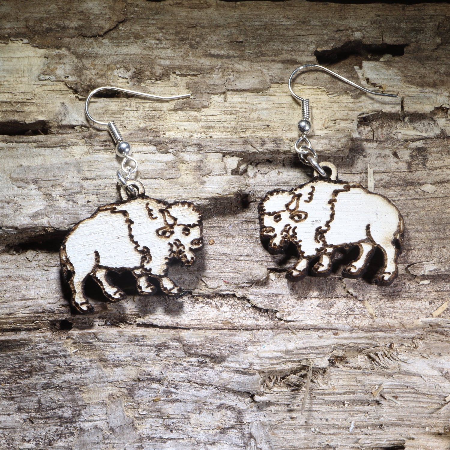 Handcrafted white buffalo wooden dangle earrings featuring a detailed American bison silhouette with engraved accents. Lightweight laser-cut wooden earrings with hypoallergenic .925 sterling silver hooks, perfect for wildlife lovers, Western style, National Park enthusiasts, buffalo fans, and handmade nature-inspired jewelry.