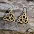 Handcrafted wooden Celtic Trinity Knot dangle earrings featuring the timeless Triquetra symbol in a natural wood finish with precision laser-cut detailing. These lightweight Celtic earrings are finished with hypoallergenic .925 sterling silver hooks, making them a meaningful accessory for Celtic heritage, Irish traditions, pagan and spiritual practices, Renaissance fairs, and everyday wear.