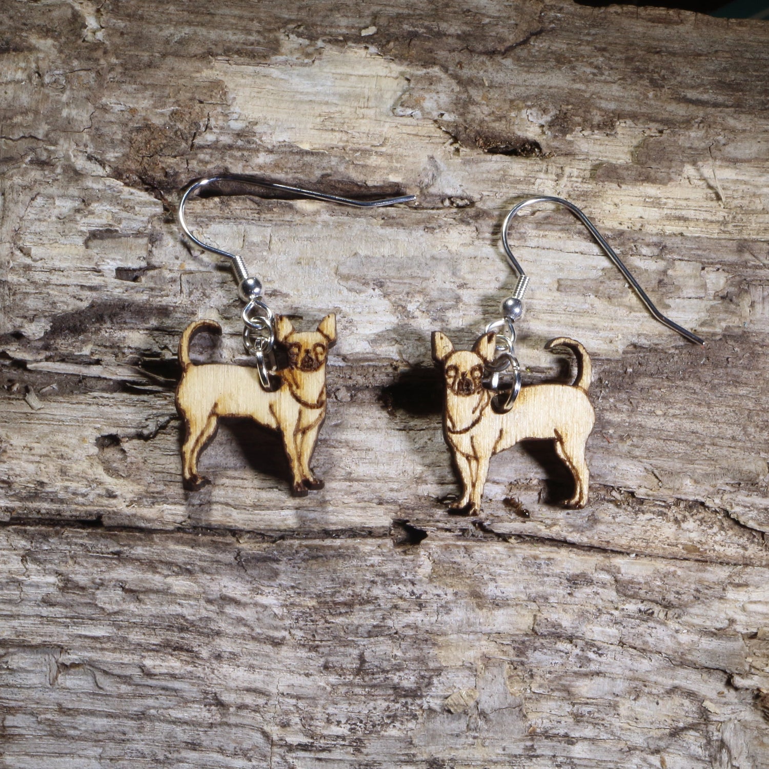 Handmade Chihuahua wooden dangle earrings featuring adorable hand-painted Chihuahua dogs with detailed facial features. Lightweight dog lover earrings crafted from wood with hypoallergenic .925 sterling silver hooks, perfect for Chihuahua owners, pet parents, dog lovers, toy breed enthusiasts, and unique handmade animal jewelry.