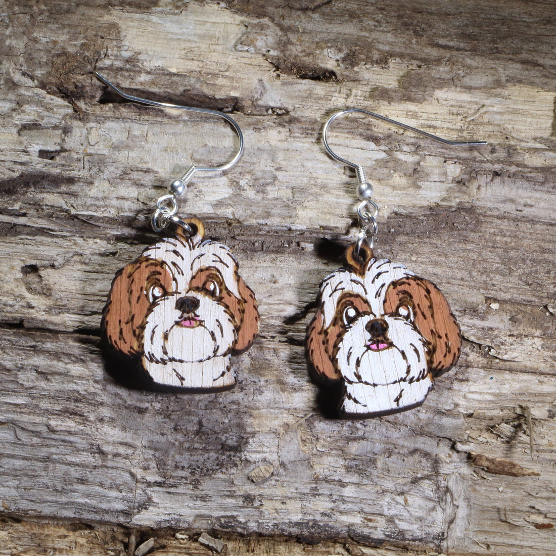 Handmade Shih Tzu wooden dangle earrings featuring adorable hand-painted Shih Tzu dogs with detailed facial features. Lightweight dog lover earrings crafted from wood with hypoallergenic .925 sterling silver hooks, perfect for Shih Tzu owners, pet parents, dog lovers, toy breed enthusiasts, and unique handmade animal jewelry.