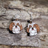 Handmade Shih Tzu wooden dangle earrings featuring adorable hand-painted Shih Tzu dogs with detailed facial features. Lightweight dog lover earrings crafted from wood with hypoallergenic .925 sterling silver hooks, perfect for Shih Tzu owners, pet parents, dog lovers, toy breed enthusiasts, and unique handmade animal jewelry.