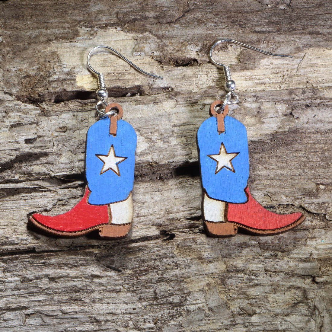 Handmade Texas Lone Star cowboy boot wooden dangle earrings featuring classic western boots with a bold Lone Star design. Lightweight Texas earrings crafted from wood with hypoallergenic .925 sterling silver hooks, perfect for Texas pride, western fashion, country music fans, rodeo enthusiasts, cowgirls, and unique cowboy jewelry collectors.