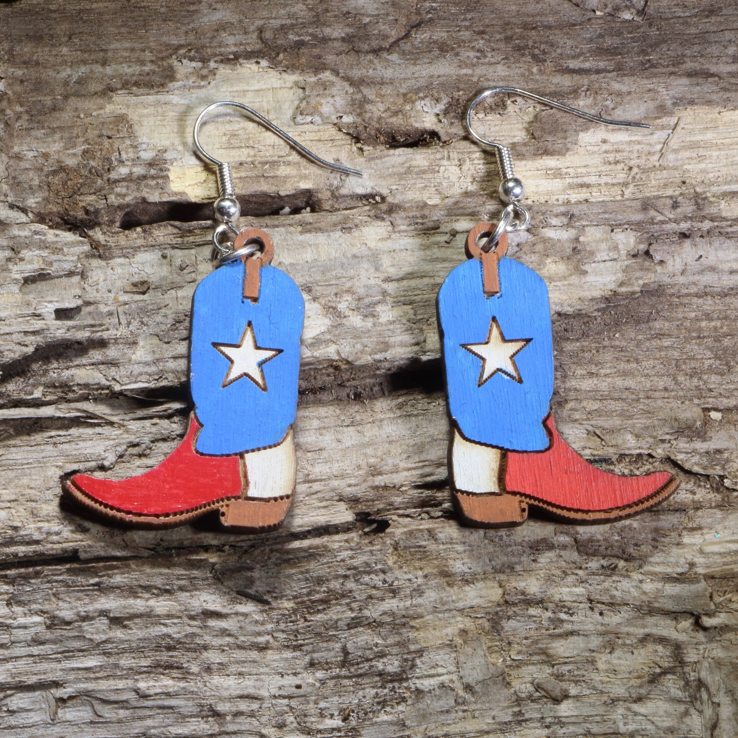 Handmade Texas Lone Star cowboy boot wooden dangle earrings featuring classic western boots with a bold Lone Star design. Lightweight Texas earrings crafted from wood with hypoallergenic .925 sterling silver hooks, perfect for Texas pride, western fashion, country music fans, rodeo enthusiasts, cowgirls, and unique cowboy jewelry collectors.