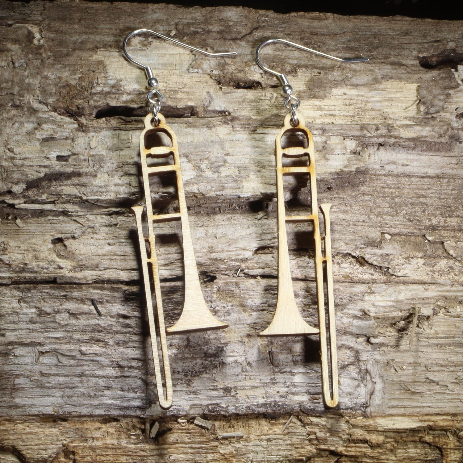 Handmade wooden trombone dangle earrings crafted from lightweight laser-cut wood with hypoallergenic .925 sterling silver hooks. Detailed brass instrument earrings make a perfect gift for trombone players, music teachers, orchestra musicians, jazz bands, and marching band enthusiasts.