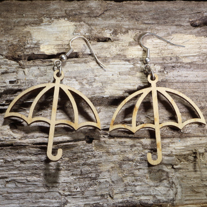 Handmade wooden umbrella dangle earrings featuring an open umbrella silhouette on hypoallergenic .925 sterling silver hooks. Lightweight weather-inspired jewelry for rainy day lovers, spring fashion, umbrella collectors, and unique everyday accessories.