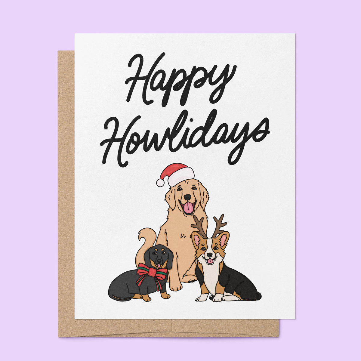Happy Howlidays Card flat lay — illustrated Christmas card for dog parents by indie artist MangoIllustrated
