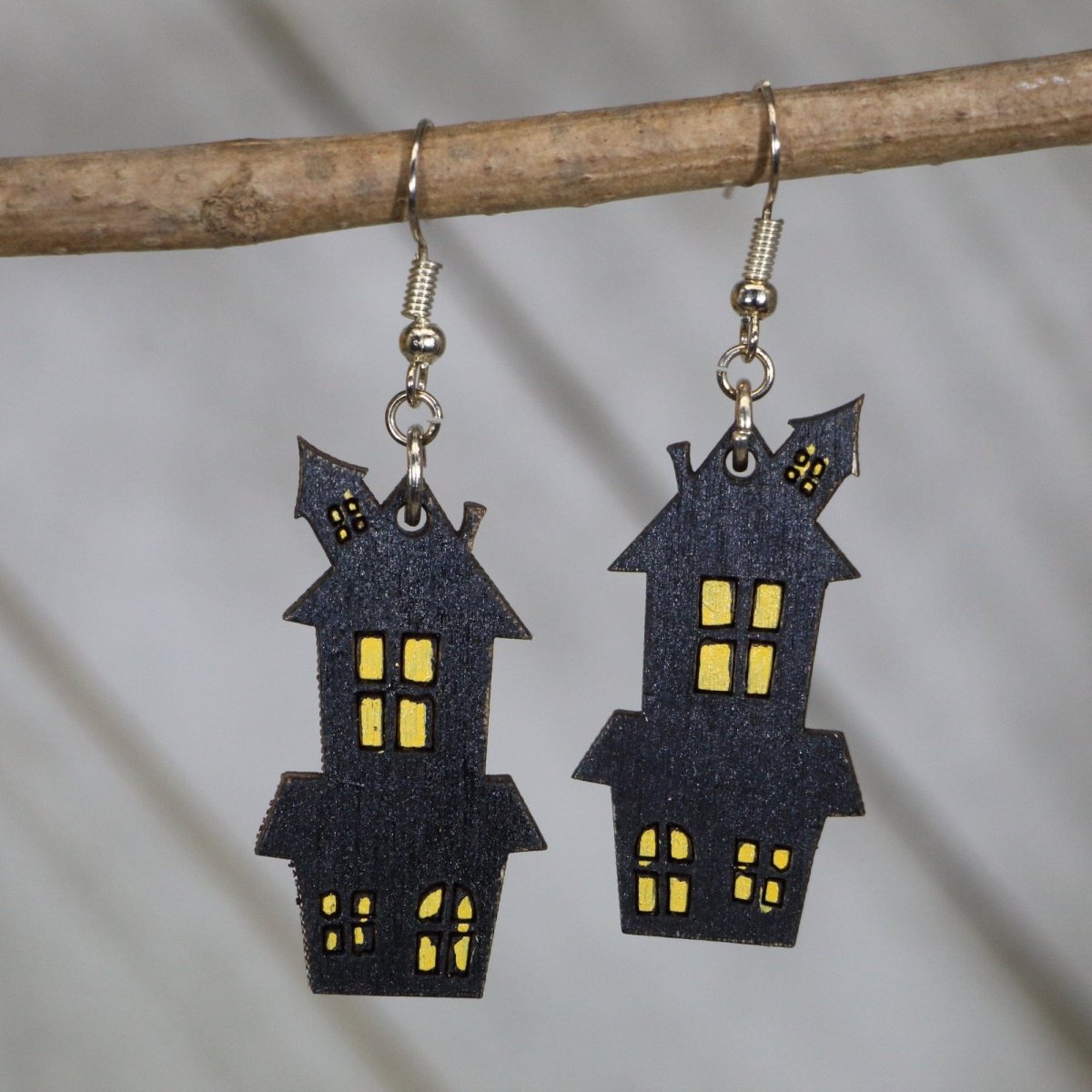 Hand-painted wooden haunted house dangle earrings with spooky Halloween design and hypoallergenic sterling silver hooks, lightweight haunted house statement jewelry earrings for gothic fall and spooky season style