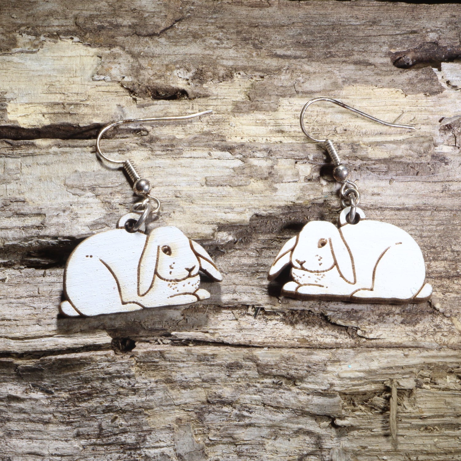 Handcrafted Holland Lop rabbit wooden dangle earrings featuring adorable floppy-eared bunny designs with hand-painted details. Lightweight laser-cut wooden earrings with hypoallergenic .925 sterling silver hooks, perfect for Holland Lop owners, rabbit lovers, bunny enthusiasts, pet parents, and unique handmade animal jewelry.