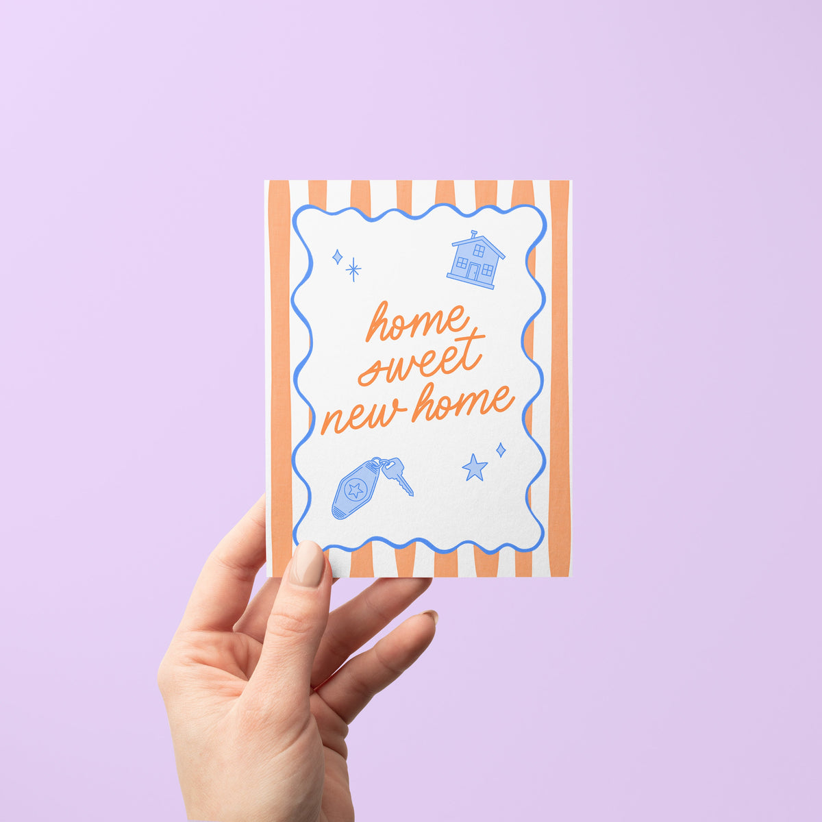 Home Sweet New Home Illustrated Housewarming Card flat lay — retro striped new home and moving congratulations card by indie artist MangoIllustrated