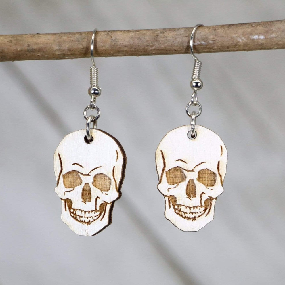 Hand-painted wooden human skull dangle earrings with gothic Halloween design and hypoallergenic sterling silver hooks, lightweight skull statement jewelry earrings for spooky style